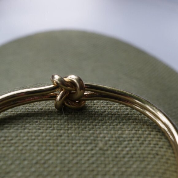 Women`s gold tone knot cuff bracelet. 2 1/2in. ID - Picture 5 of 5